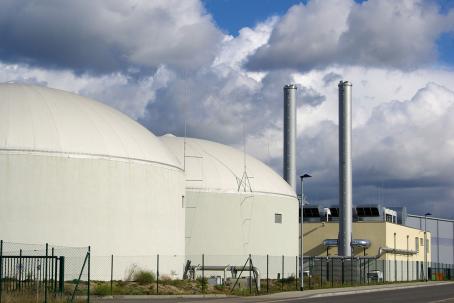 A biogas plant produces biogas, which could replace fossil fuels in electrical power production.