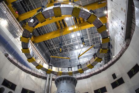 A poloidal coil is inserted into the Tokamak Pit. (Credit © ITER Organization, http://www.iter.org/)