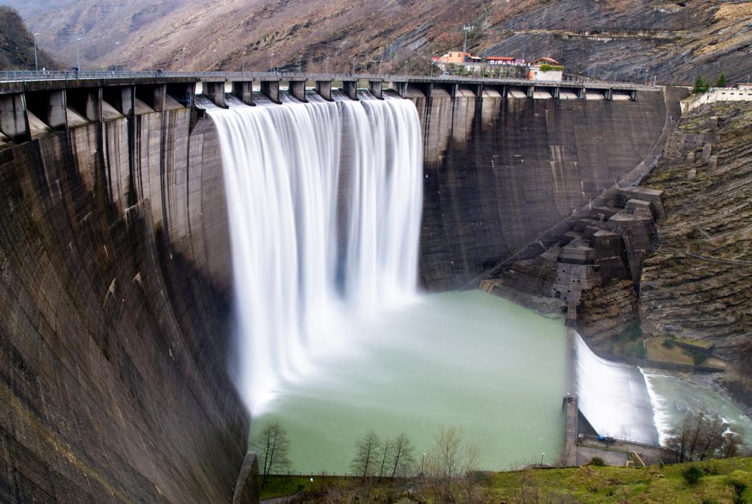 An artificial waterfall formed by water flowing through spillways over the edge of a dam when the water level is high.