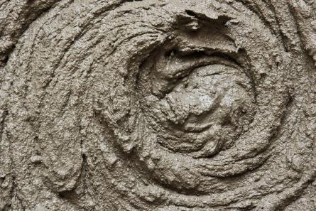 Radioactive waste is often immobilised in cement. Liquid concentrates, sludges and suitable solid waste can be incorporated into a cement matrix and packaged in steel or concrete containers. (Source: © alekswolff / stock.adobe.com)