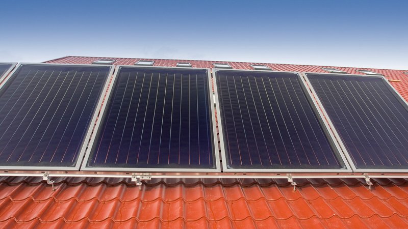 The absorber of a flat-plate collector has a dark selective coating that efficiently absorbs solar radiation while reducing radiative heat losses. (Source: © Tudor Stanica / stock.adobe.com)