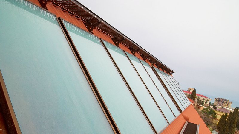 An array of interconnected flat-plate solar water-heating collectors. (Source: © Pavlo Vakhrushev / stock.adobe.com)