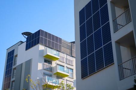 A photovoltaic system integrated into the façade of a modern building.
