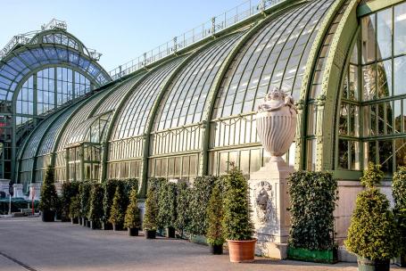 The steel structure of an antique greenhouse — still a functional work of art.