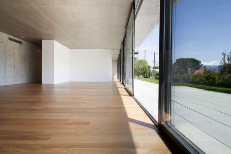 A glazed wall in a hallway of a residential house — a passive element in solar architecture.