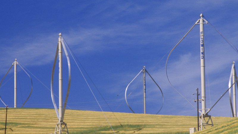 Guy wires anchored to the ground provide additional structural support for these Darrieus vertical-axis wind turbines. (Source: © spiritofamerica / stock.adobe.com)